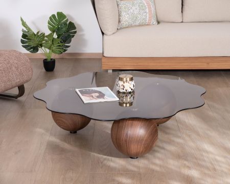 Mesa de centro de formas orgánicas con tablero de cristal ahumado «Cyléa» y patas esféricas
