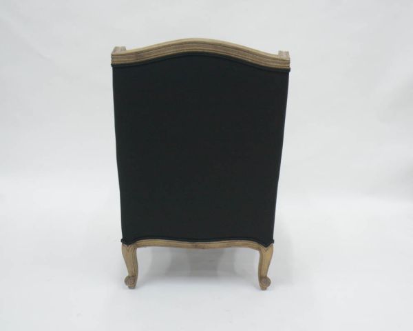 Sillón bergère «Sofía» de madera maciza y tela blanca y negra con rombos